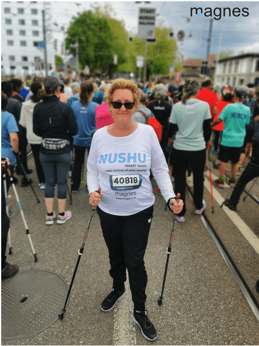 Person standing during a marathon with the NUSHU smart shoes